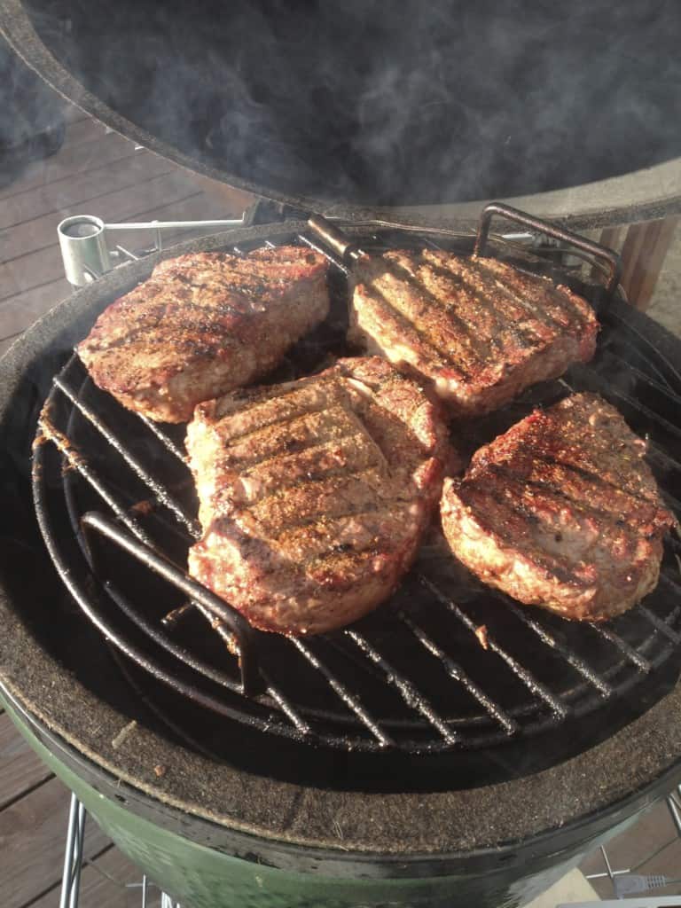 Steaks roasting away from direct heat