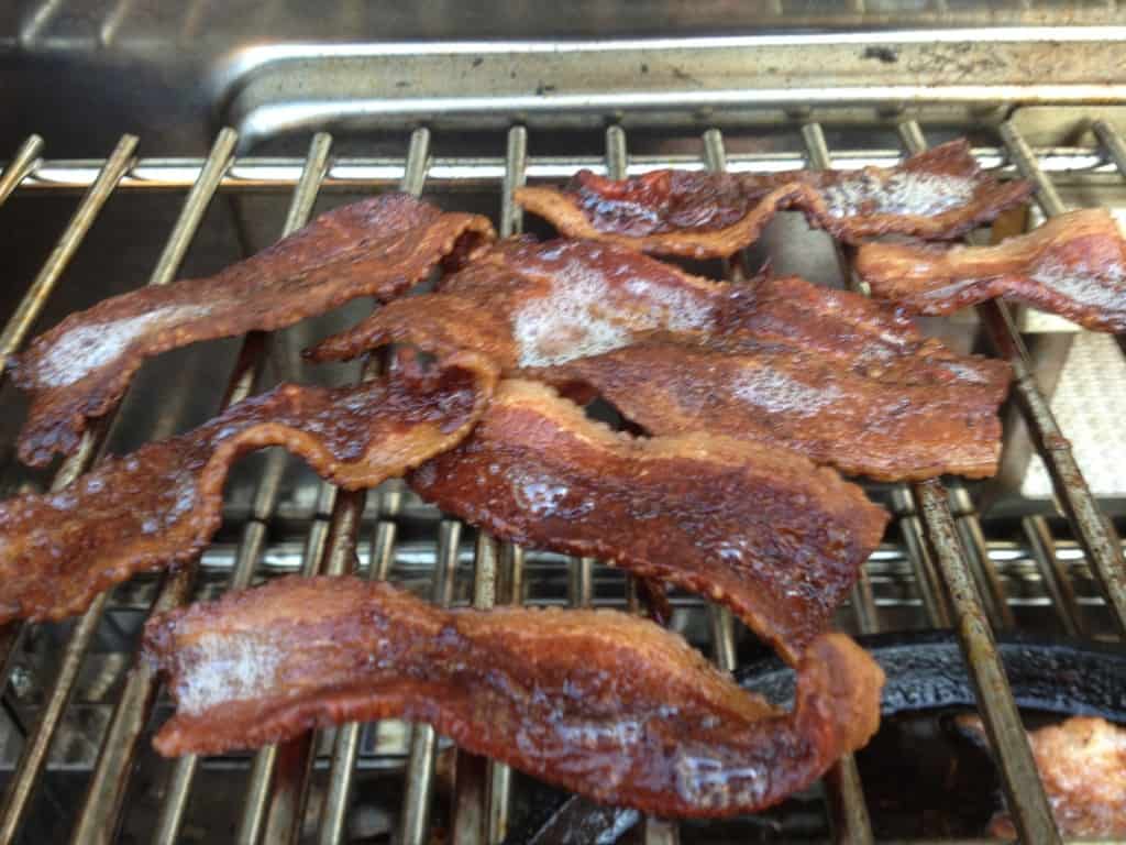 Bacon cooking on the grill