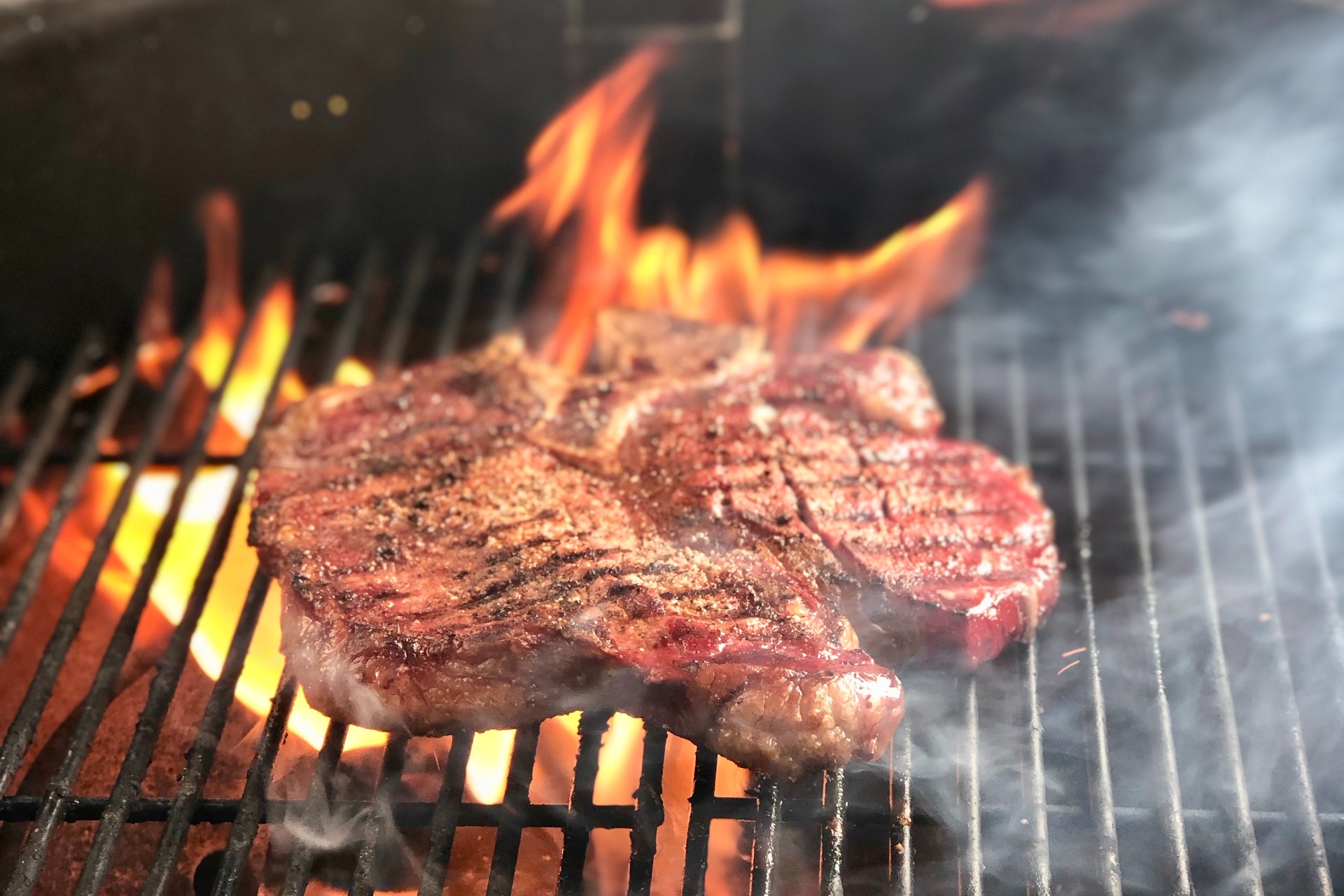 A steak cooking with fire