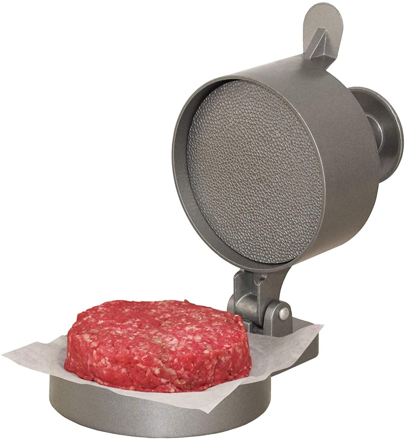 A burger press with raw burger