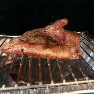 pork brisket on a smoker