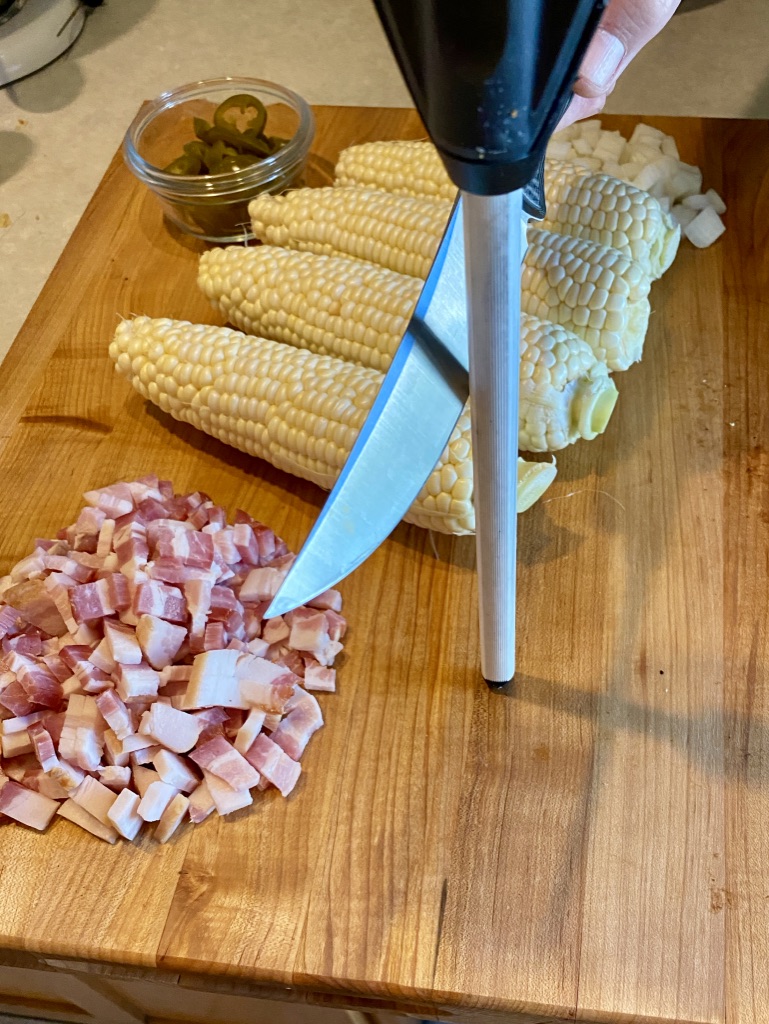 honing a knife on cutting board