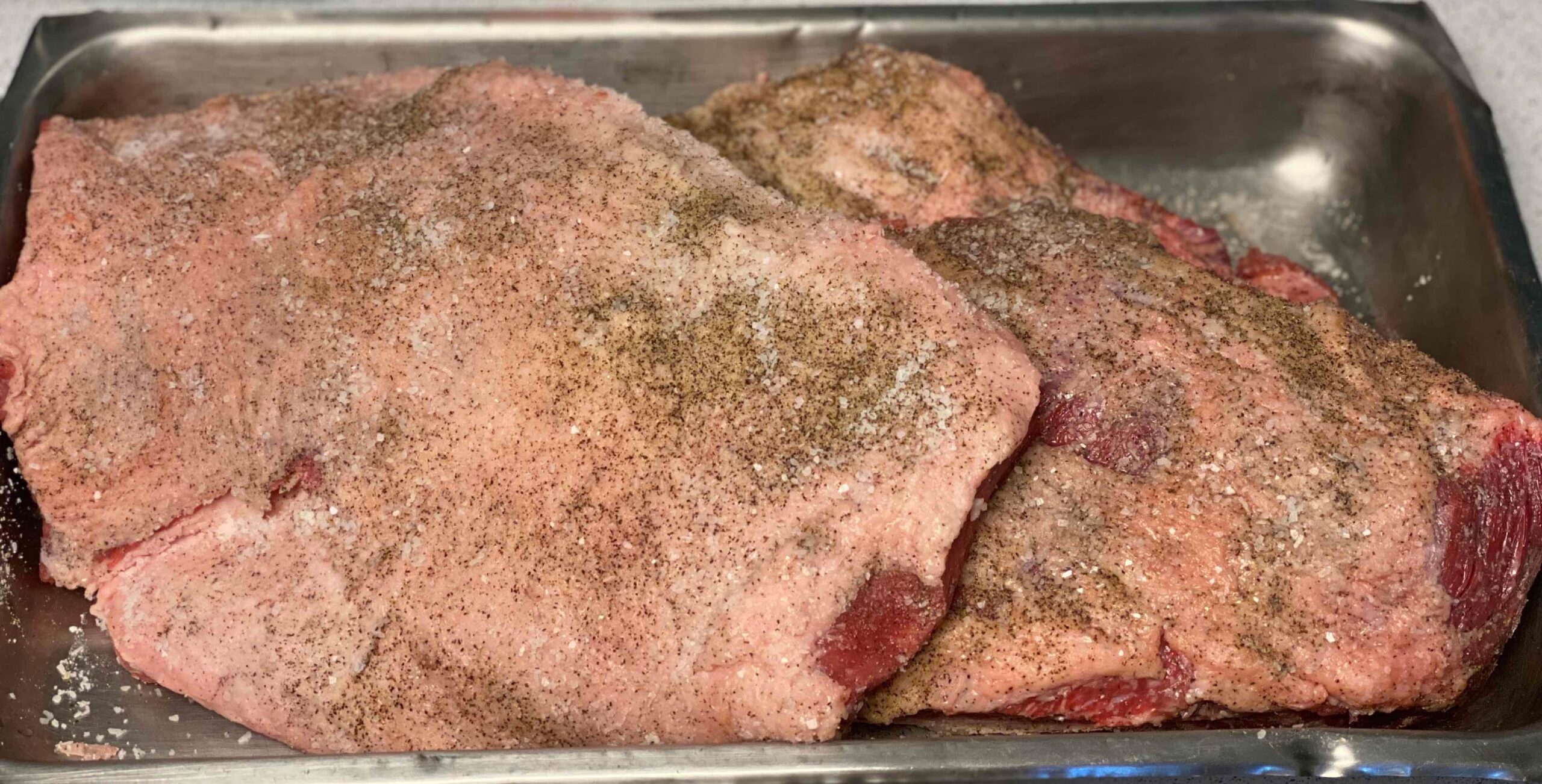 brisket seasoned and ready for the smoker