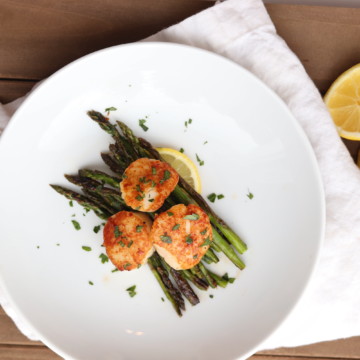 scallops and asparagus cooked on blackstone griddle