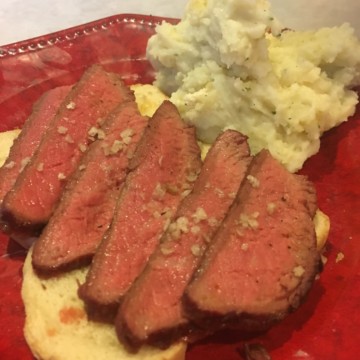 steak cooked on griddle with potato