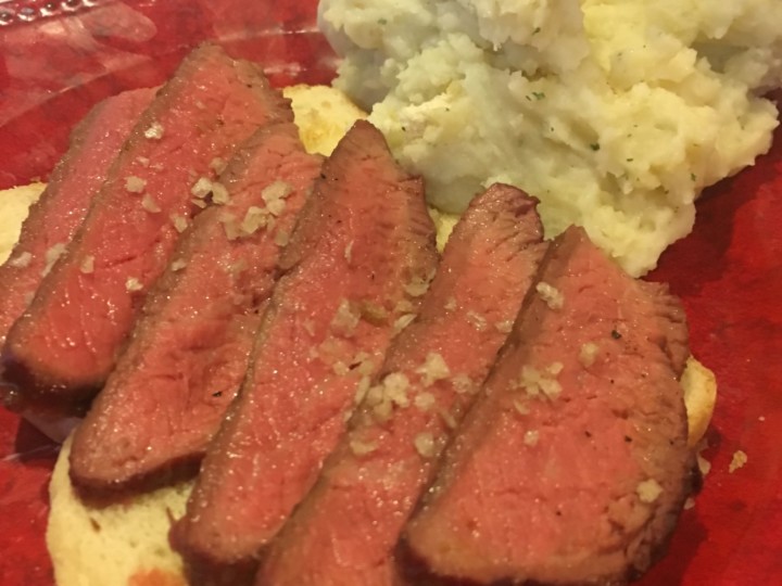 steak cooked on griddle with potato