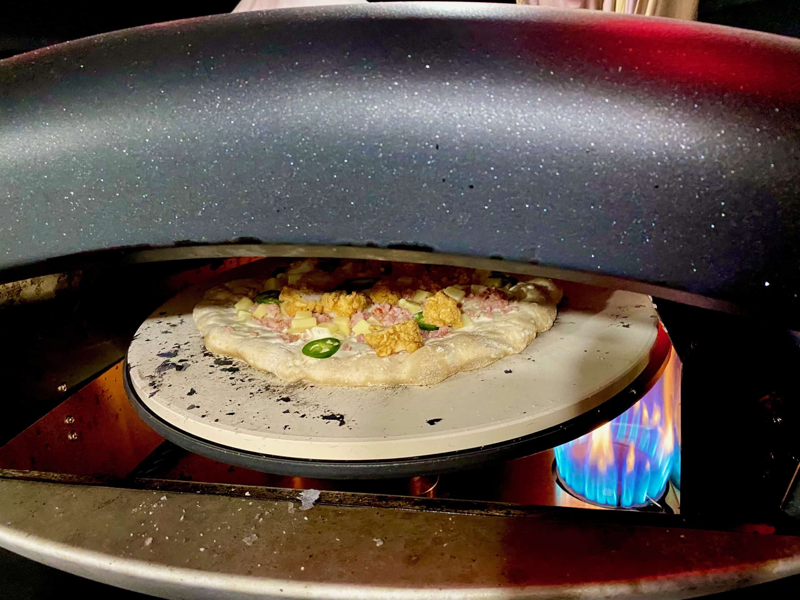 pizza cooking in an oven