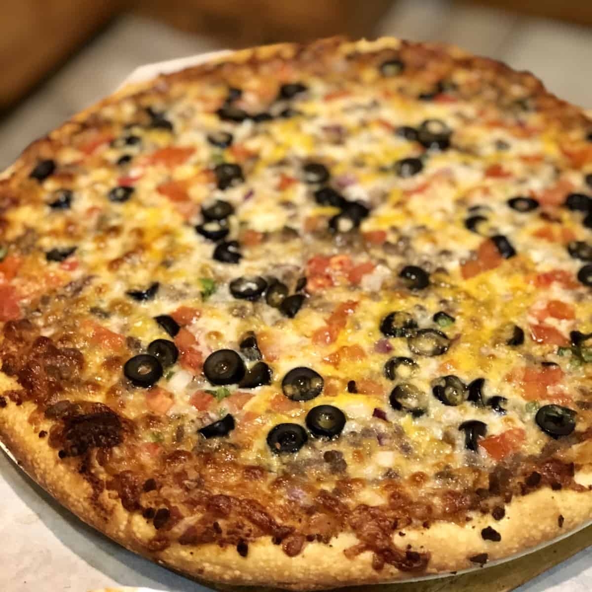Pizza with olives and other toppings
