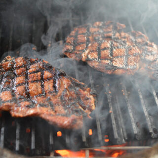 reverse sear steak cooking on grill grates